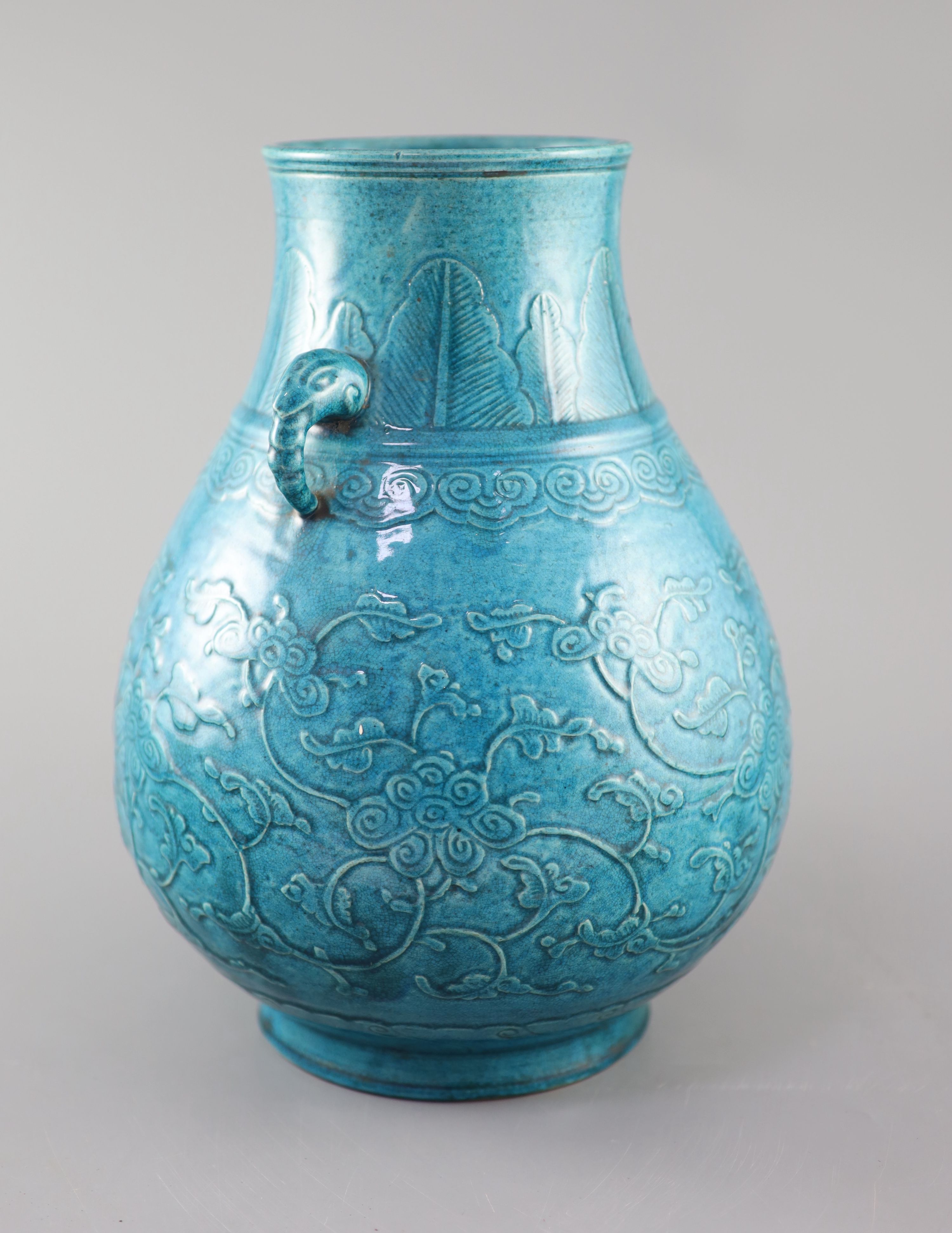 A Chinese turquoise glazed vase, Hu, late Qing dynasty, 31cm high. overall height 41cm.